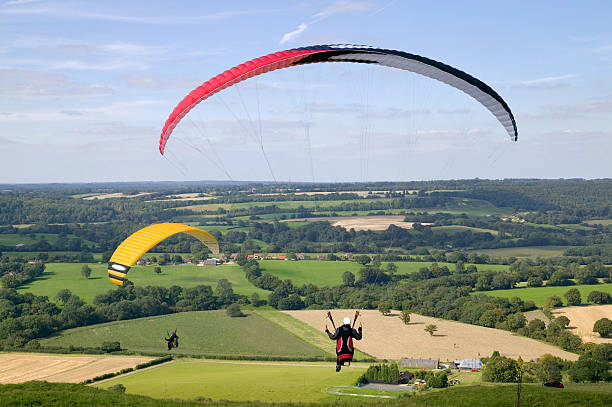 istock Paragliders over flat land on sunny day 104760000