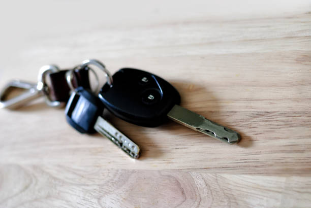 istock Car key on wooden background 1047600332