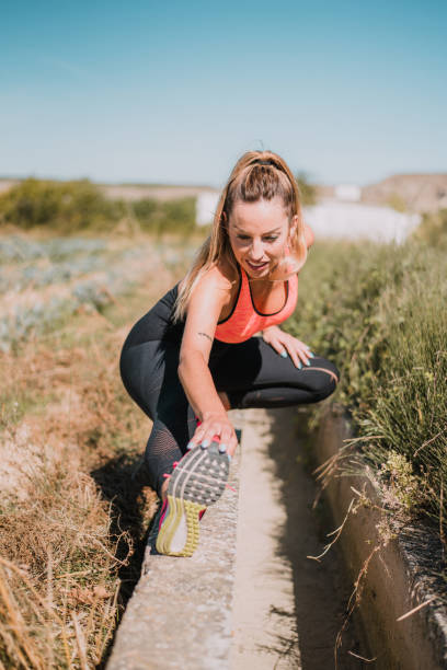 istock Young athlete stretching outdoors 1047603702