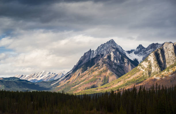 istock Dramatic Cloudscape Sky and Distant Snowcapped Mountain Peaks Canadian Rockies 1047603718