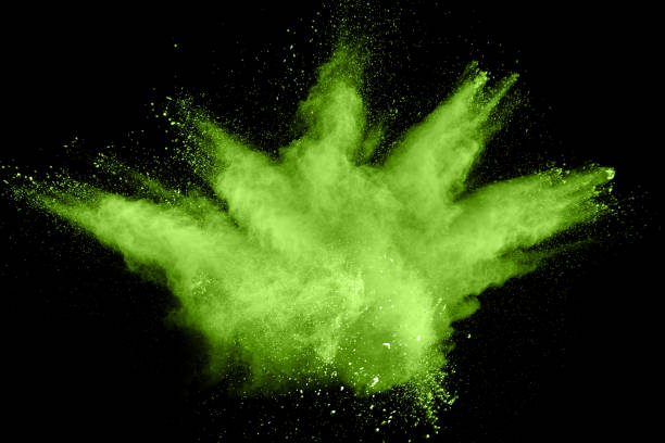 istock Green color powder explosion cloud on black background.Green dust splash on dark background. 1047606054