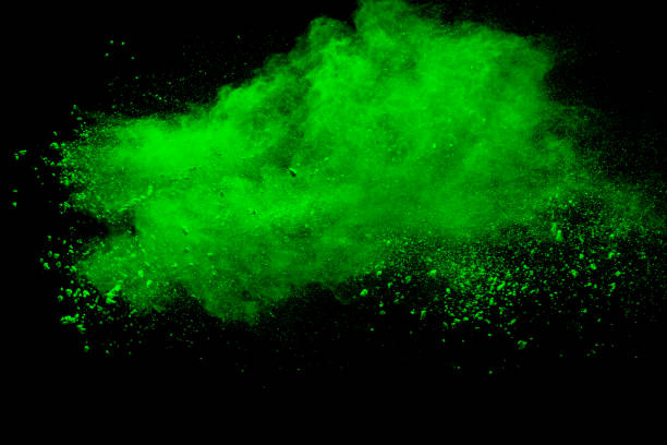 istock Green color powder explosion cloud on black background.Green dust splash on dark background. 1047606098