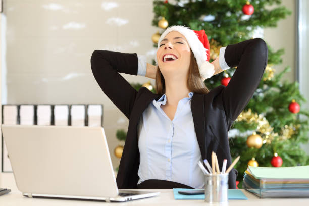 istock Satisfied employee celebrating christmas at office 1047609528