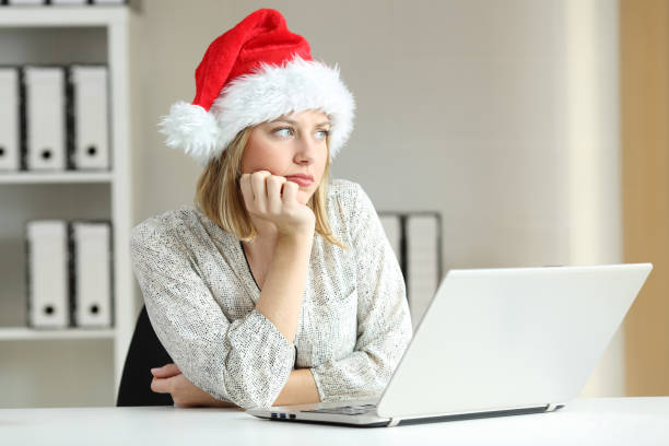 istock Sad employee at office in christmas 1047610092