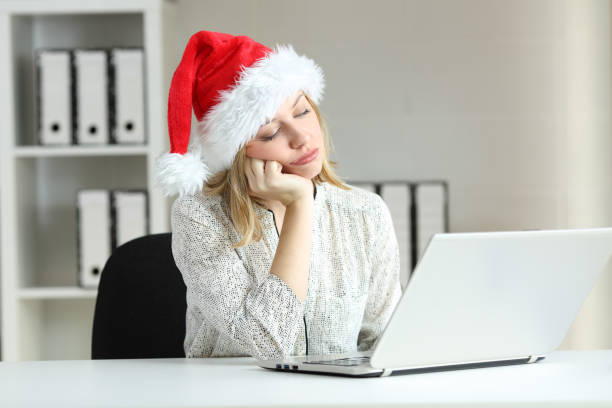 istock Bored employee working at office in christmas 1047610138