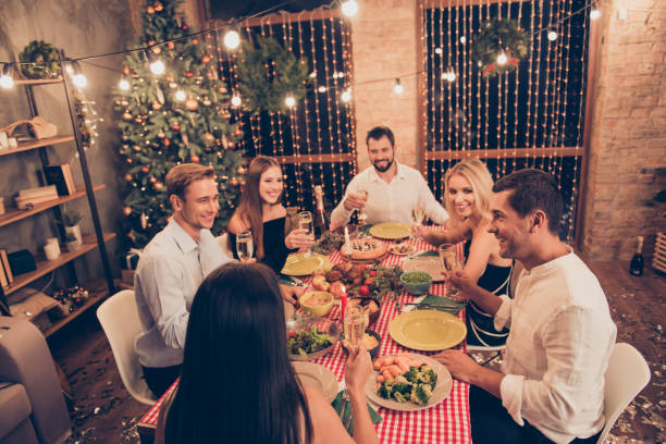 istock Six people having evening dinner, elegant classy charming beautiful fashionable cute positive cheerful ladies and handsome gentlemen at house festive, chill out, holding glasses, saying toast 1047612532