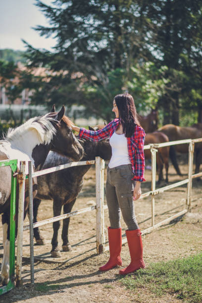 istock Young woman and foal 1047612610