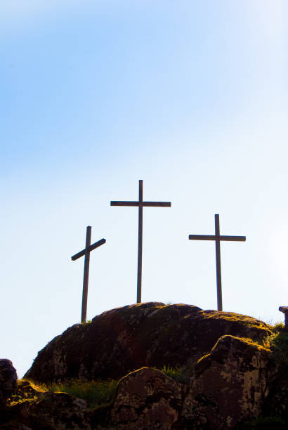 istock Three big Christian crosses outside in blue sky 1047613134