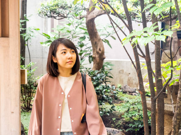 istock Thai woman visiting small garden in Tokyo. 1047614112
