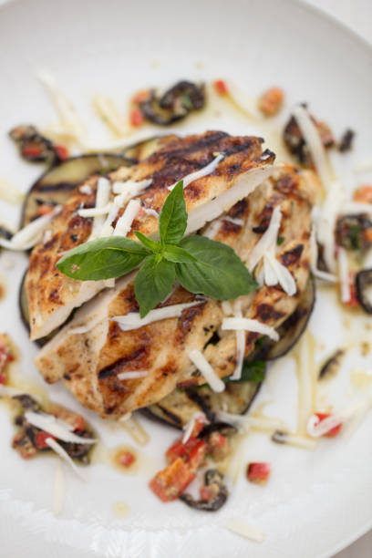 istock italian styled chicken on white background 1047615142