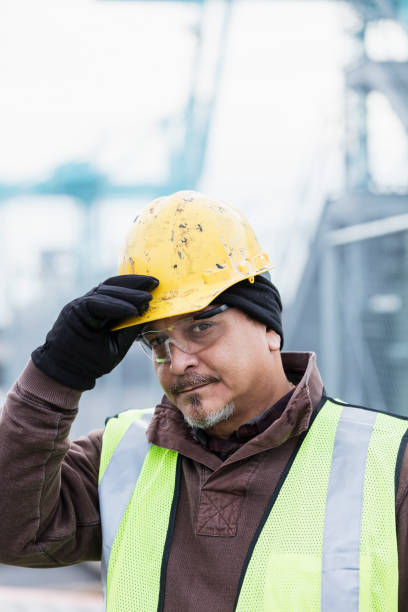 istock Hispanic dock worker at shipping port 1047617110