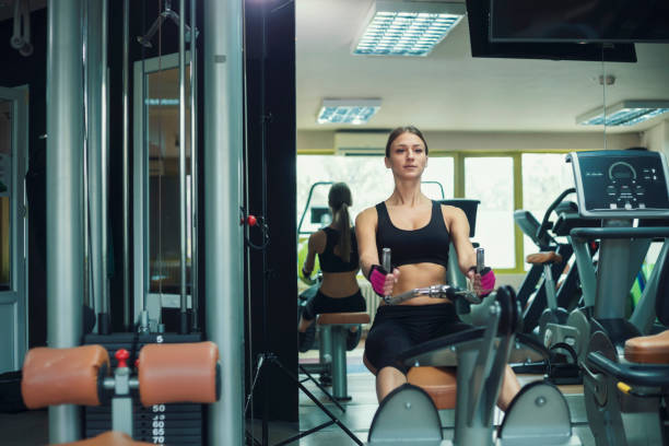 istock Athlete woman exercising in gym 1047617490