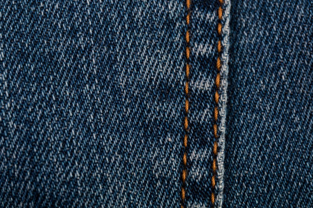 istock Denim jeans texture background with seam closeup 1047620510