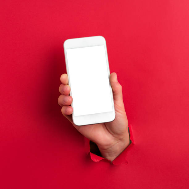 téléphone intelligent de la main de l’homme montrant - telephone communication human hand red photos et images de collection