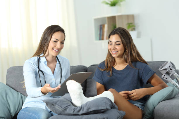 istock Doctor talking with a disabled outpatient at home 1047625230