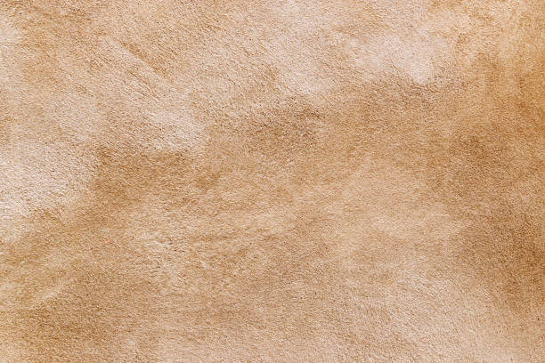 istock grunge brown concrete wall textured background. 1047627600