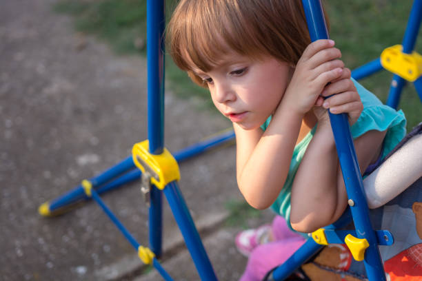 istock Cute Girl on Swing 1047627616