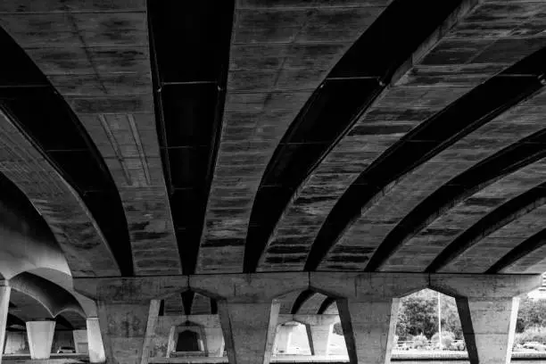 Black and white photo from under the Narrows Bridge, Perth Australia