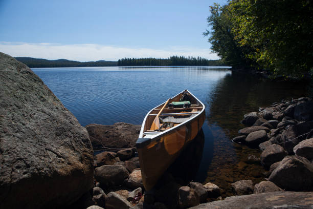 istock Canoe by the lake 1047631588