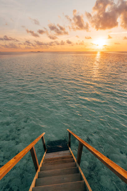 istock Chasing the sun in Maldives 1047631758