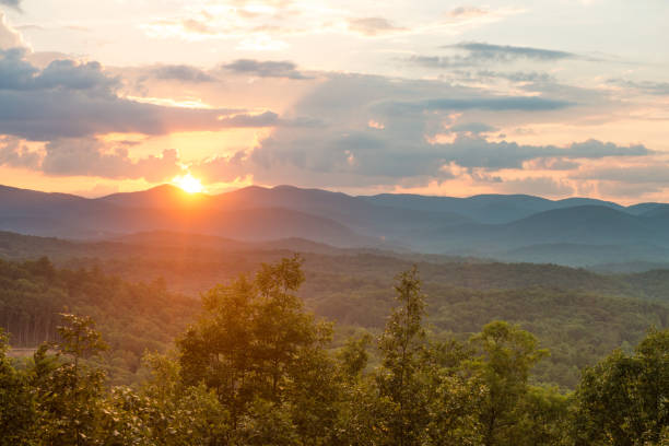 Sunset View of Georgia Blue Ridge Mountains Landscape in Southern USA Scenic sunset view of Blue Ridge Mountain landscape near Helen, Georgia in Sautee Nacoochee, Georgia in Southern USA on a cloudy summer afternoon. georgia country stock pictures, royalty-free photos & images