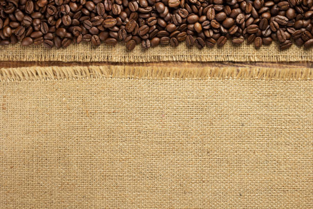 coffee beans on wooden background, top view