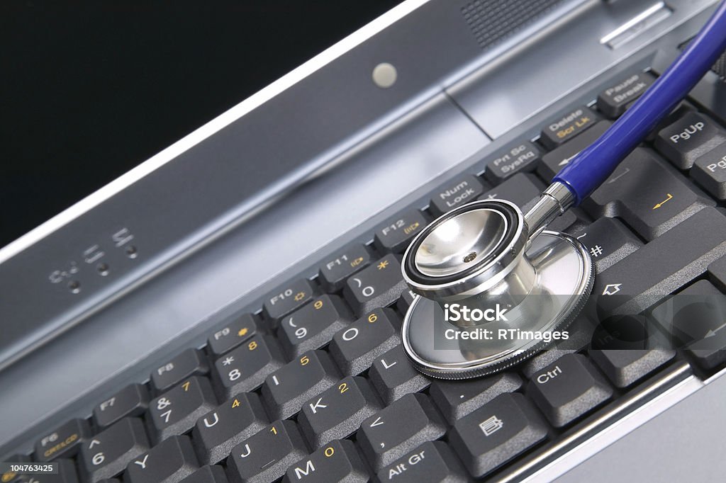 Laptop &amp; Stethoscope Computer health image of a stethoscope on a laptop keyboard. Accessibility Stock Photo