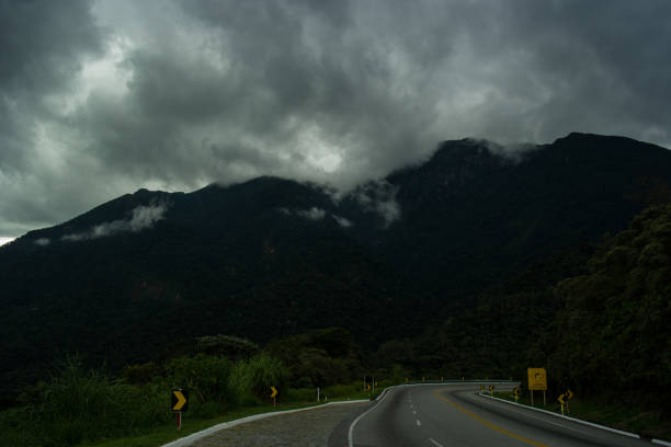 istock Road, mountains and cloudy sky 1047634918