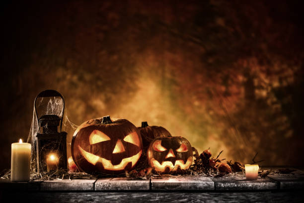 istock Halloween pumpkins on old wooden planks. 1047636008