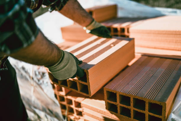 House under construction in residential housing development nearing lock-up stage