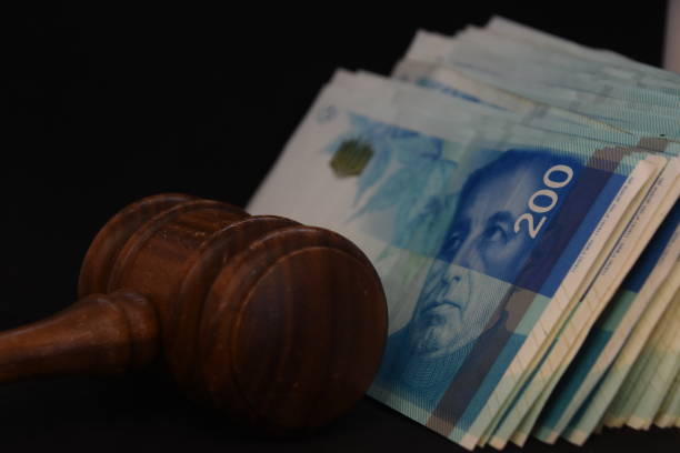 istock Hammer judge and money on a BLACK background 1047640754