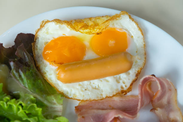 istock Homemade breakfast with fried egg and bacon 1047643540