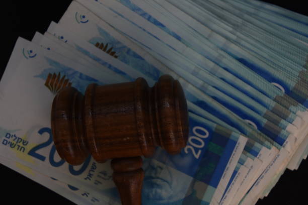istock Hammer judge and money on a BLACK background 1047643560