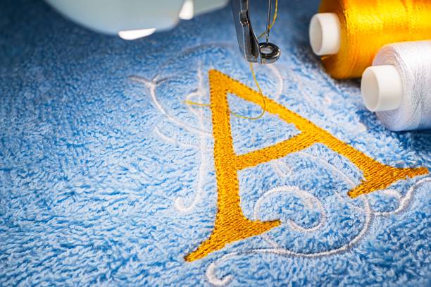 istock Embroidery machine and logo design on towel 1047644686