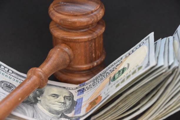 istock Hammer judge and money on a BLACK background 1047645536