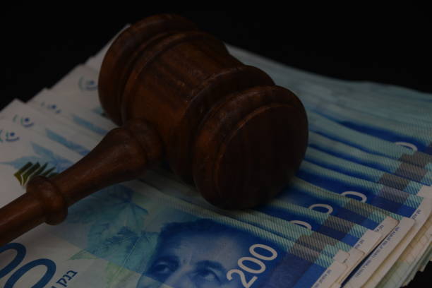 istock Hammer judge and money on a BLACK background 1047645548