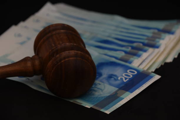 istock Hammer judge and money on a BLACK background 1047647812