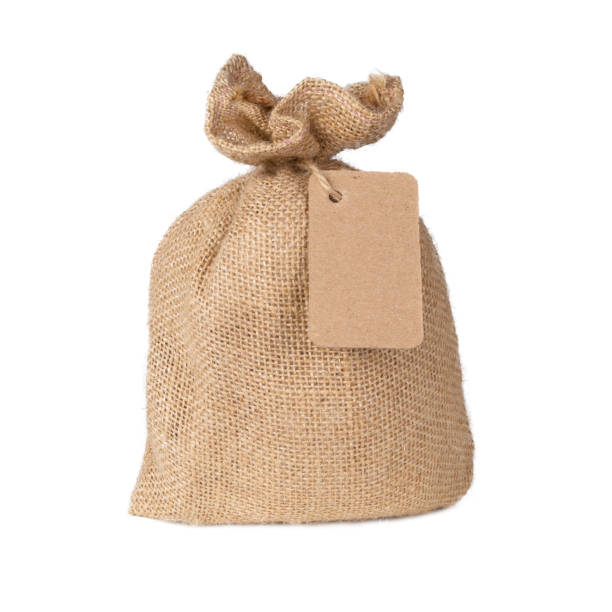 istock Canvas sack bag with blank label isolated on white background 1047647866