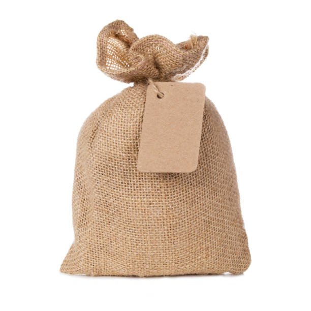 istock Canvas sack bag with blank label isolated on white background 1047647868