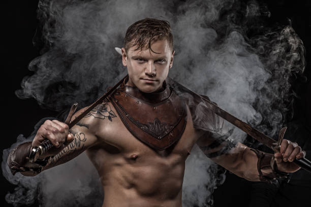 istock Sword wielding bloody viking warrior in studio shot 1047648314