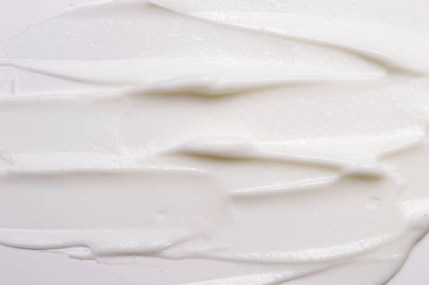 istock Cosmetic liquid cream for skin white background texture 1047648316