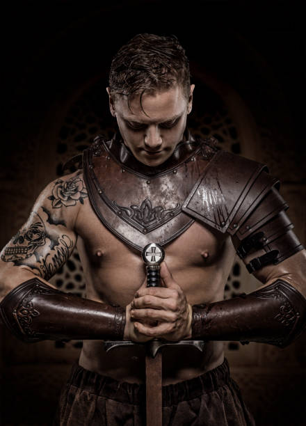 istock Sword wielding bloody viking warrior in studio shot 1047648358