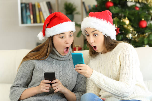 istock Amazed friends finding online offers in christmas 1047649960
