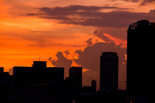 istock sky with clouds over the evening city 1047653760