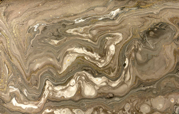 istock Gold marbling texture design. Beige and golden marble pattern. Fluid art. 1047653892
