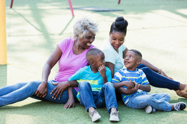istock Multi-generation family sitting on playground 1047653954