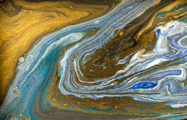 istock Gold marbling texture design. Blue and golden marble pattern. Fluid art. 1047654108