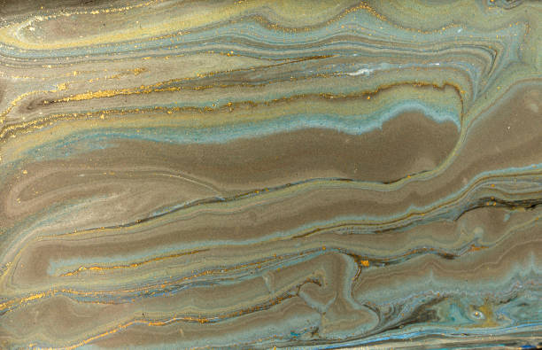 istock Gold marbling texture design. Blue and golden marble pattern. Fluid art. 1047654870