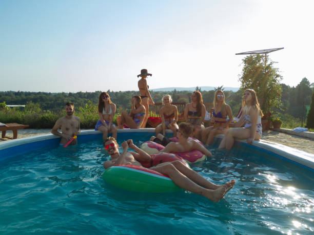 istock Drone view on the swimming pool with young people 1047656798
