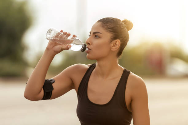 istock Sports Woman Drinking Water 1047656842